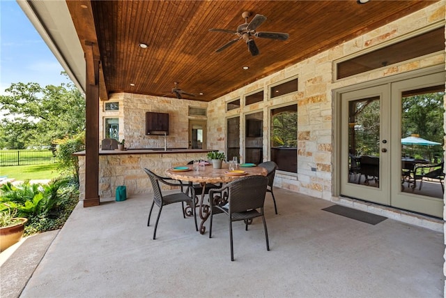 18265 Windmill Ct, College Station, TX 77845 - view of patio / terrace with french doors, a ceiling fan, and outdoor dining space