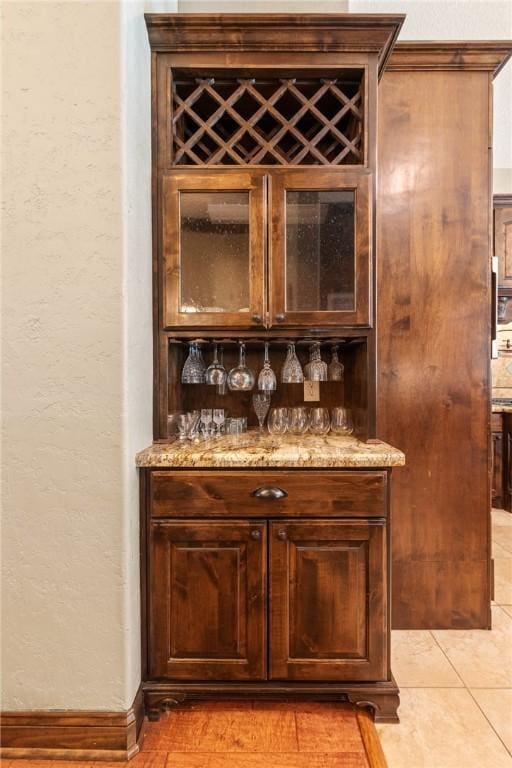 18265 Windmill Ct, College Station, TX 77845 - indoor dry bar featuring a textured wall and light tile patterned floors