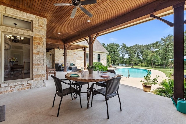 18265 Windmill Ct, College Station, TX 77845 - view of patio / terrace featuring a ceiling fan and an outdoor pool