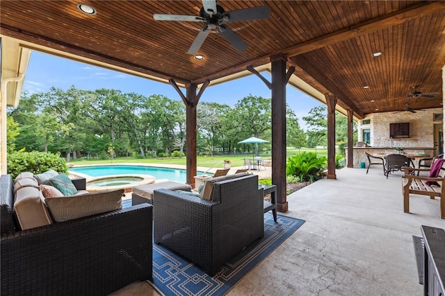 18265 Windmill Ct, College Station, TX 77845 - view of patio featuring a ceiling fan, view of scattered trees, outdoor dining space, a pool with connected hot tub, and outdoor lounge area