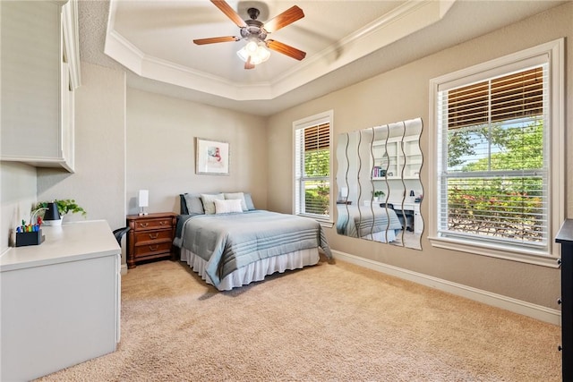 18265 Windmill Ct, College Station, TX 77845 - bedroom featuring a raised ceiling, crown molding, light colored carpet, and ceiling fan