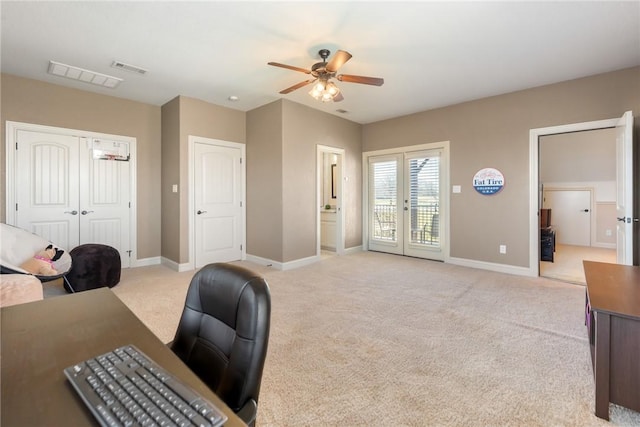 office space with a ceiling fan, baseboards, light carpet, and french doors