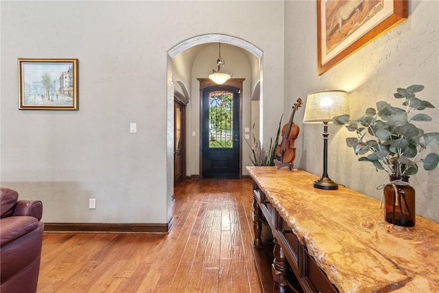 18265 Windmill Ct, College Station, TX 77845 - foyer entrance featuring arched walkways and hardwood / wood-style floors