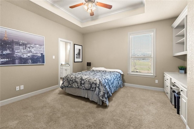 bedroom with baseboards, light carpet, ornamental molding, and a raised ceiling