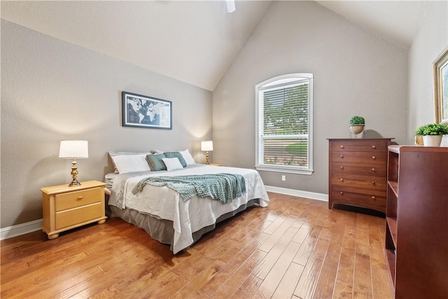 18265 Windmill Ct, College Station, TX 77845 - bedroom featuring multiple windows, light wood-style floors, and vaulted ceiling