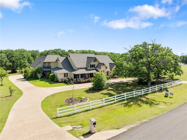 18265 Windmill Ct, College Station, TX 77845 - view of front facade featuring curved driveway and stone siding