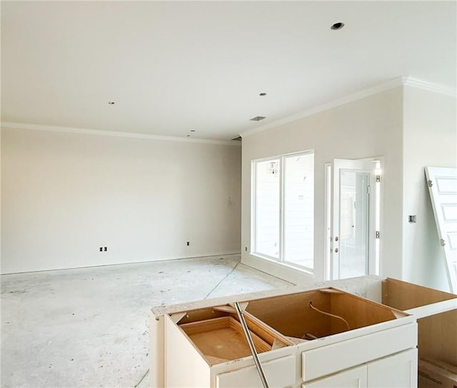 kitchen featuring white cabinetry and crown molding