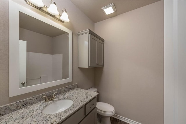 bathroom with vanity and toilet