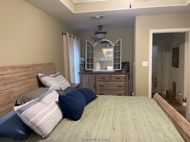 bedroom with wood-type flooring