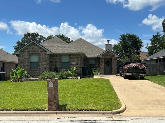 2402 Pleasant Rose Cir, Bryan, TX 77808 - view of front facade featuring brick siding, a chimney, concrete driveway, and roof with shingles