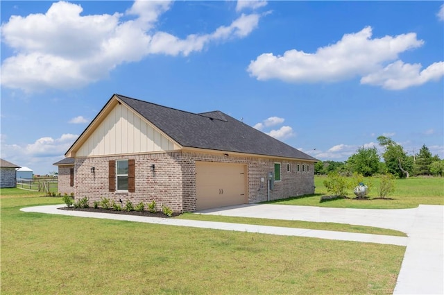 3310 Hunters Crossing Trl, Bryan, TX 77808 - view of property exterior with brick siding, board and batten siding, driveway, a garage, and a lawn