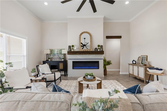 3310 Hunters Crossing Trl, Bryan, TX 77808 - living area featuring ceiling fan, baseboards, recessed lighting, crown molding, and a glass covered fireplace