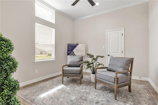 3310 Hunters Crossing Trl, Bryan, TX 77808 - living area featuring a ceiling fan, wood finished floors, baseboards, and crown molding