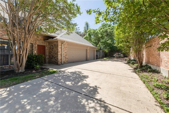 view of side of property featuring a garage