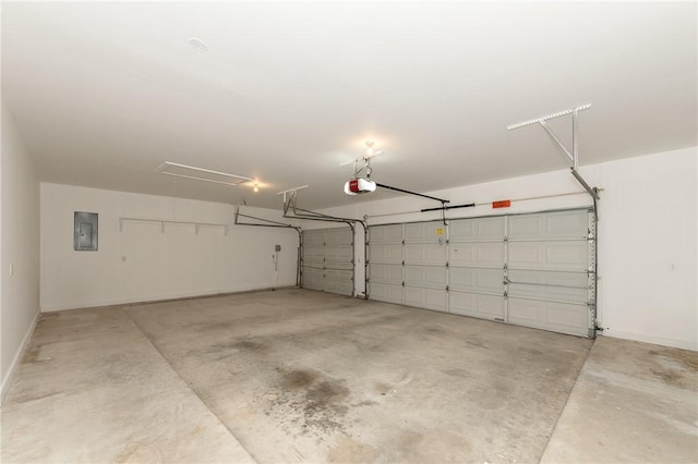 9300 Lakeside Ct, College Station, TX 77845 - garage featuring a garage door opener, electric panel, and baseboards