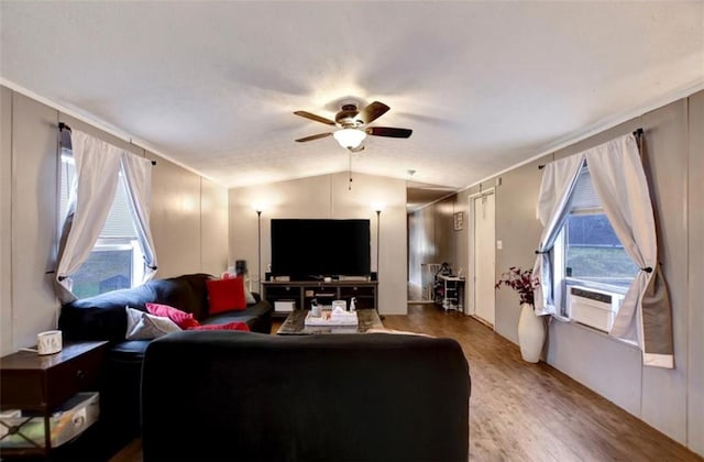 living room with ceiling fan, cooling unit, lofted ceiling, and wood finished floors