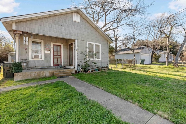 bungalow-style house with a front lawn