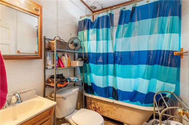 full bathroom featuring vanity, shower / bathtub combination with curtain, and toilet