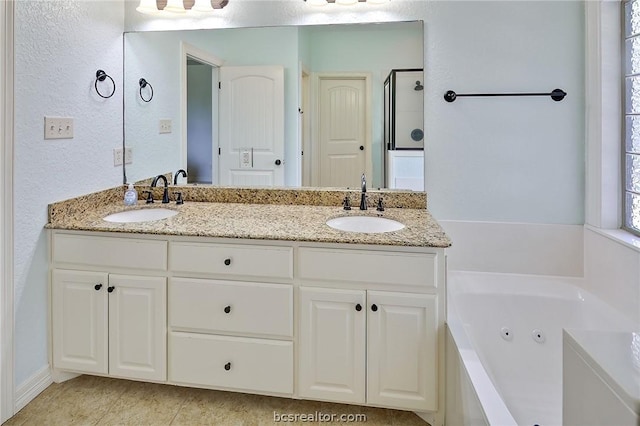 bathroom with vanity and separate shower and tub