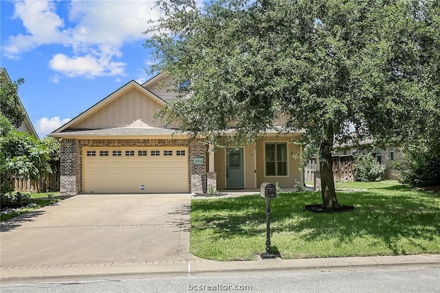 view of front facade with a front yard and a garage