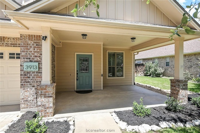 view of exterior entry with a garage