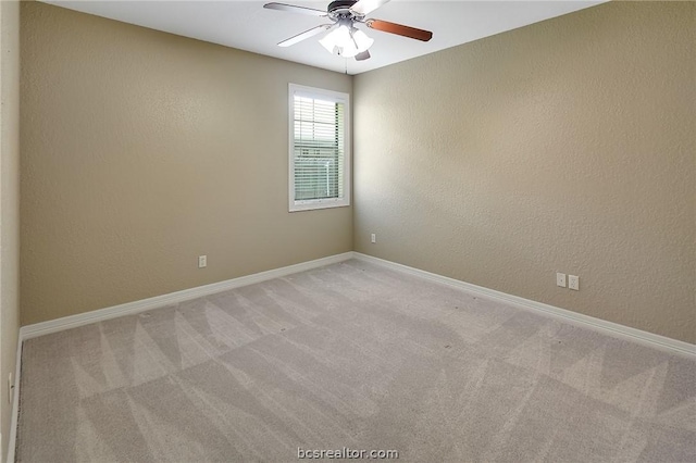 unfurnished room featuring ceiling fan and light colored carpet