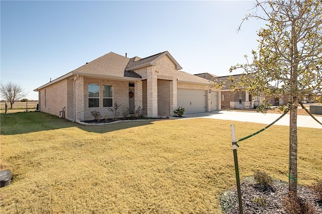 ranch-style house with a garage and a front yard