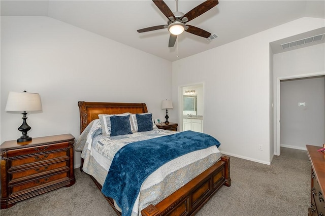 carpeted bedroom featuring ceiling fan, ensuite bathroom, and lofted ceiling