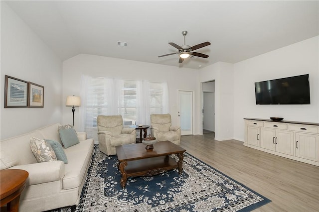 living room featuring ceiling fan and light wood-type flooring