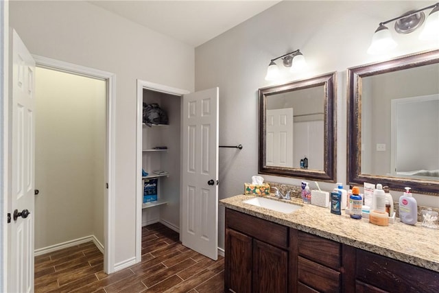 bathroom with vanity and wood-type flooring