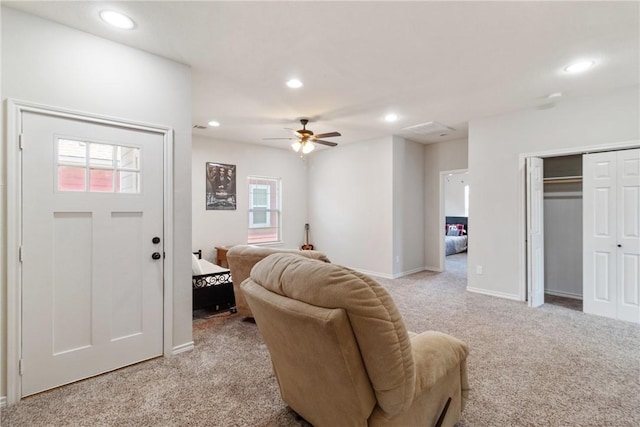 living room with light carpet and ceiling fan