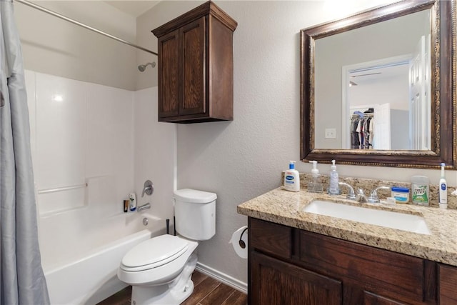 full bathroom featuring shower / tub combo with curtain, vanity, wood-type flooring, and toilet