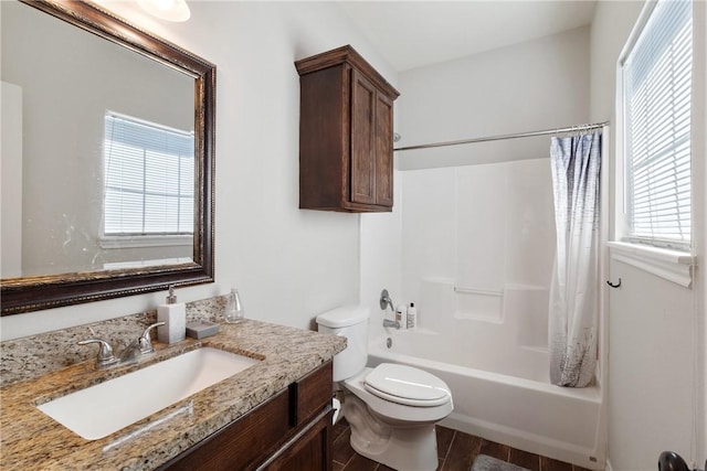 full bathroom featuring shower / tub combo, hardwood / wood-style flooring, toilet, and plenty of natural light