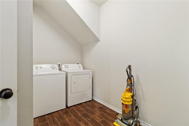 laundry room with dark hardwood / wood-style flooring and washer and dryer