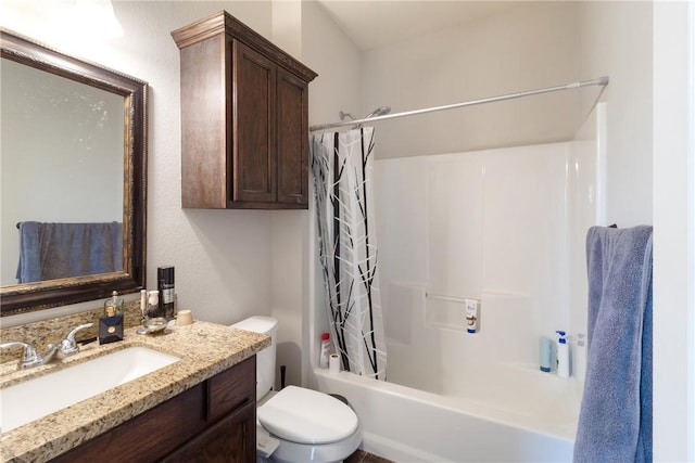 full bathroom featuring vanity, shower / bath combination with curtain, and toilet