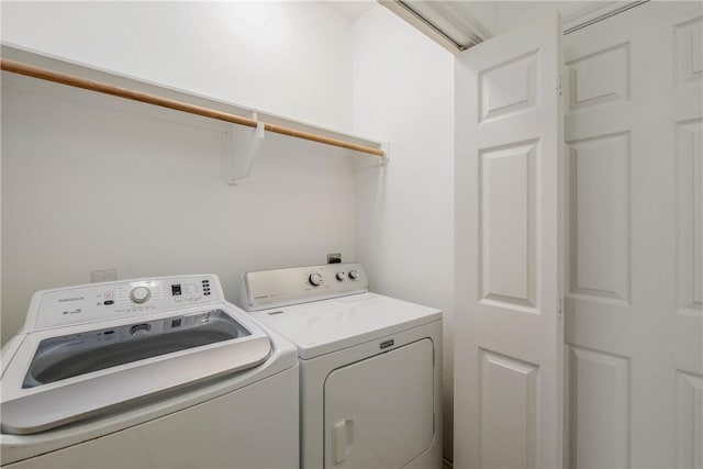 laundry area with laundry area and separate washer and dryer