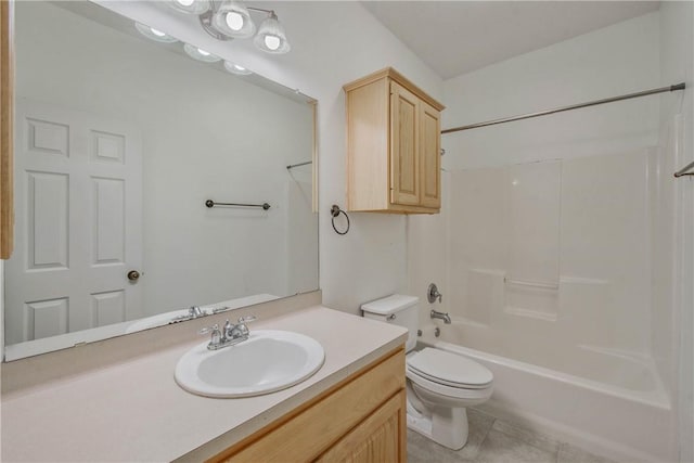 bathroom featuring tile patterned flooring, shower / bathing tub combination, vanity, and toilet