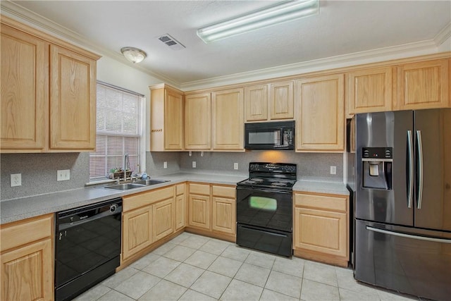 kitchen featuring black appliances, light brown cabinets, visible vents, and a sink