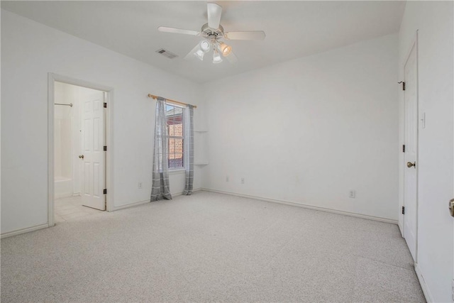 unfurnished bedroom with baseboards, carpet, visible vents, and a ceiling fan