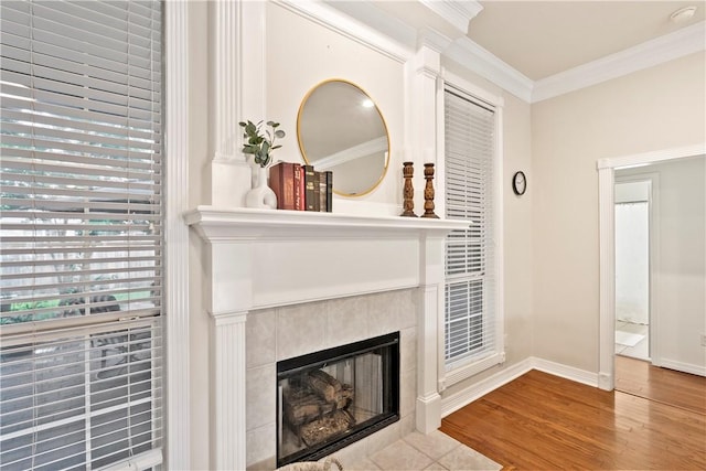 4906 Park Row Pl, Bryan, TX 77802 - detailed view of a tiled fireplace, wood finished floors, ornamental molding, and a smoke detector