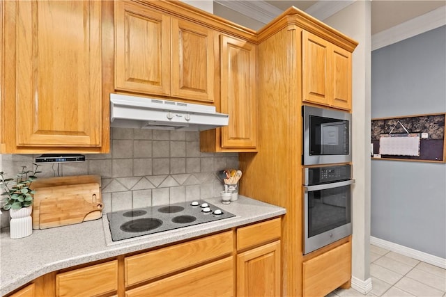 4906 Park Row Pl, Bryan, TX 77802 - kitchen featuring appliances with stainless steel finishes, under cabinet range hood, tasteful backsplash, light tile patterned flooring, and light countertops