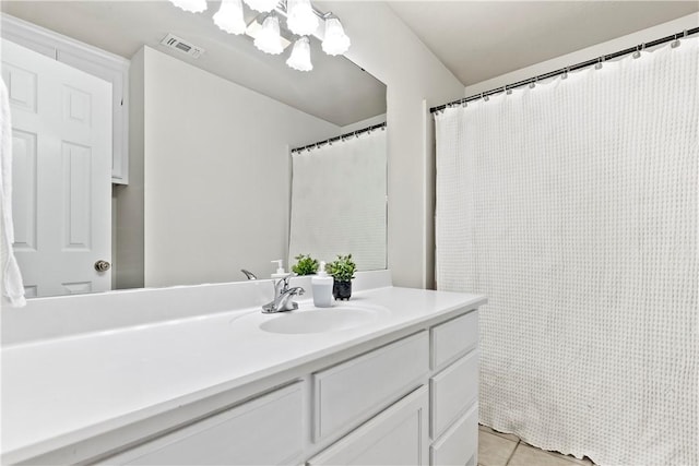 4906 Park Row Pl, Bryan, TX 77802 - full bath featuring vanity, tile patterned floors, a chandelier, and a shower with curtain