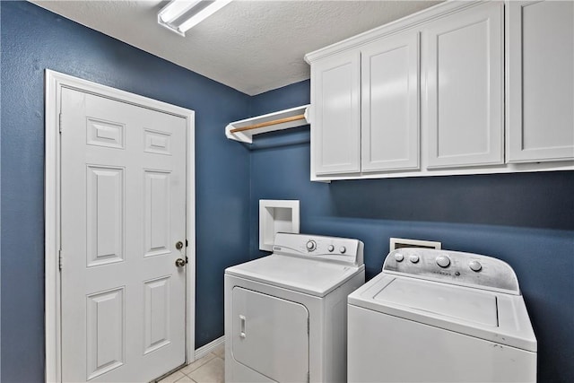 4906 Park Row Pl, Bryan, TX 77802 - washroom featuring washer and dryer, cabinet space, light tile patterned floors, and a textured ceiling