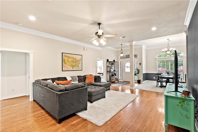4906 Park Row Pl, Bryan, TX 77802 - living room with a ceiling fan, light wood-type flooring, recessed lighting, crown molding, and a chandelier