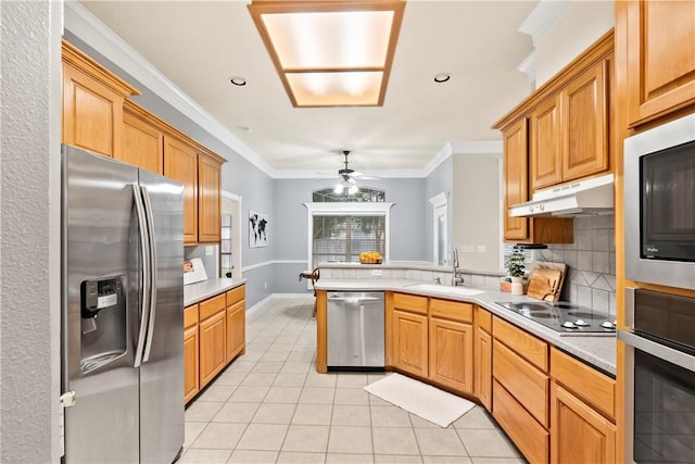 4906 Park Row Pl, Bryan, TX 77802 - kitchen featuring appliances with stainless steel finishes, light tile patterned floors, light countertops, a peninsula, and ornamental molding