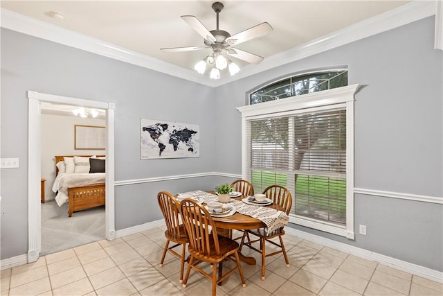4906 Park Row Pl, Bryan, TX 77802 - tiled dining room with crown molding, a ceiling fan, and carpet flooring