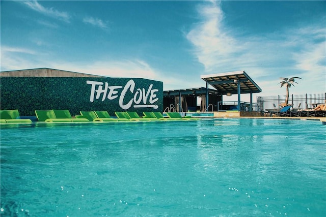 community pool featuring fence