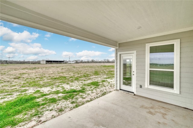 view of patio with a rural view