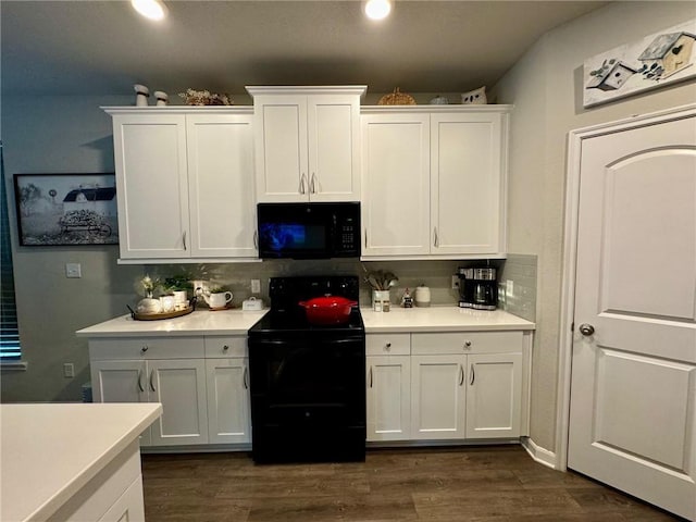 kitchen featuring black appliances, dark hardwood / wood-style floors, white cabinets, and decorative backsplash