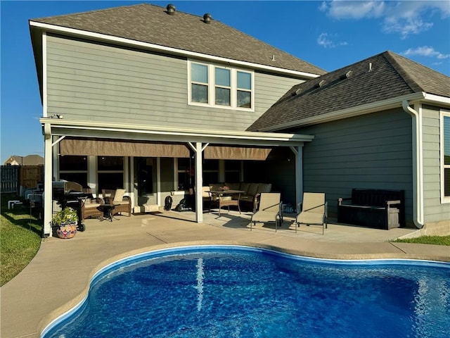 rear view of property with an outdoor hangout area and a patio area